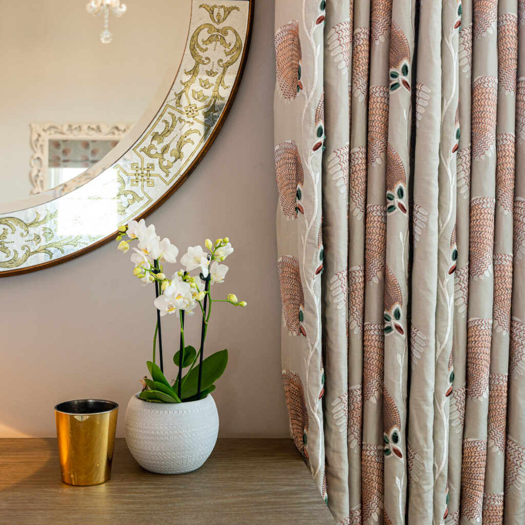 Orchid, mirror and curtains